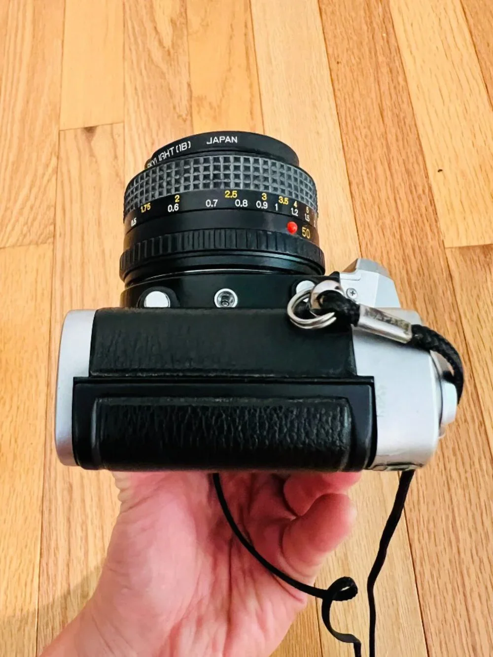 vintage Minolta XG-9 35mm SLR film camera equipped with a 50mm prime lens